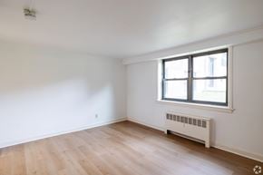 Albany apartment for rent - A room with a window and a radiator on the wall.