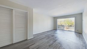 Cape Canaveral apartment for rent - A room with a sliding door and a balcony.