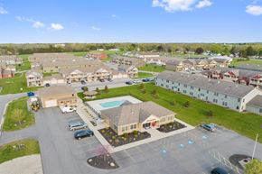 Brockport apartment for rent - an aerial view of a community with houses and a swimming pool