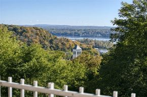 Kingston apartment for rent - a view of a river and a building in the trees