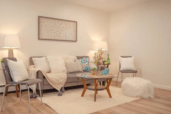 Kingston apartment for rent - a living room with a couch and a table