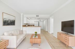Fort Myers apartment for rent - A living room with a white couch and a coffee table.