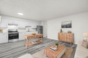 Staunton apartment for rent - A modern kitchen with a wooden coffee table in the middle.