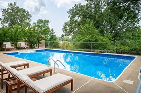 Staunton apartment for rent - A pool with a blue tinted water and a white chair.