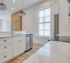 Kingston apartment for rent - a white kitchen with a sink and a window