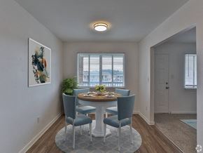 Augusta apartment for rent - a dining room with a table and chairs and a window