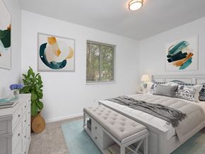 Augusta apartment for rent - a bedroom with a bed and paintings on the wall