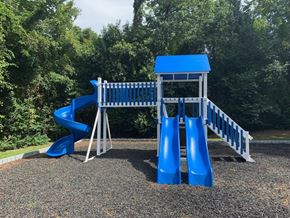 Macon apartment for rent - a playground with a blue slide and a swing set