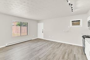 Staunton apartment for rent - the living room of an apartment with wood flooring and a window