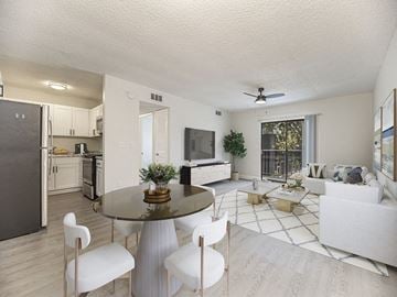 Fort Myers apartment for rent - a living room and kitchen with a table and chairs