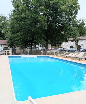 Staunton apartment for rent - A swimming pool surrounded by trees and chairs.