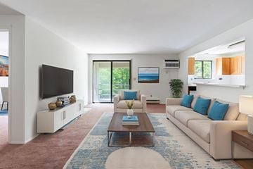 Cicero apartment for rent - A living room with a white couch and a coffee table.