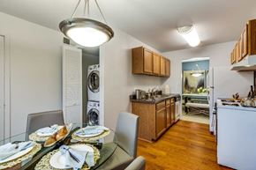 Springfield apartment for rent - A modern kitchen with a dining table set for two.