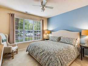 Dulles apartment for rent - a bedroom with a bed and a ceiling fan