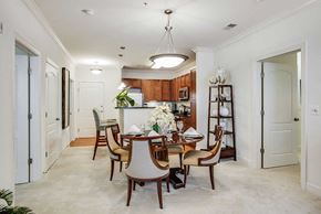 Fairfax apartment for rent - a dining room and kitchen with a table and chairs