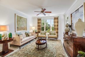 Fairfax apartment for rent - a living room filled with furniture and a ceiling fan