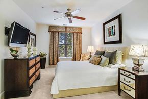 Fairfax apartment for rent - a bedroom with a large bed and a tv
