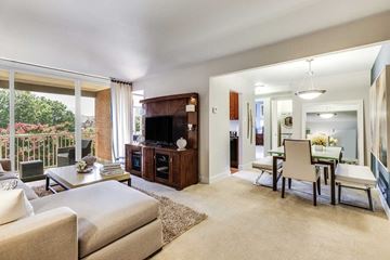 Alexandria apartment for rent - A living room with a white couch and a television.