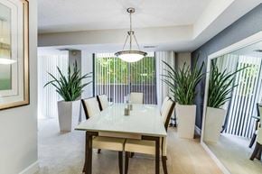 Alexandria apartment for rent - A dining room with a table and chairs.