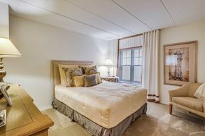 Reston apartment for rent - a bedroom with a bed and a window