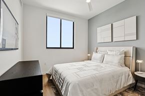 Dania Beach apartment for rent - A bedroom with a large bed and a window.