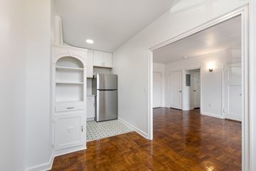 Indianapolis apartment for rent - A kitchen with white cabinets and a wooden floor.