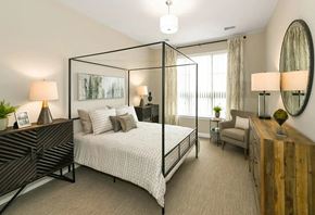 Novi apartment for rent - a bedroom with a bed and a large window at Encore at Manchester, Novi
