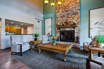 Seattle apartment for rent - a living room with a fireplace and a table
