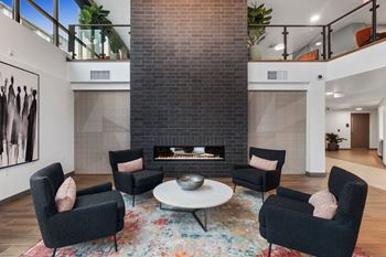 Living room with fireplace and black chairs