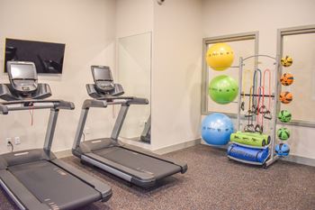 24-Hour fitness studio with cardio & free weights