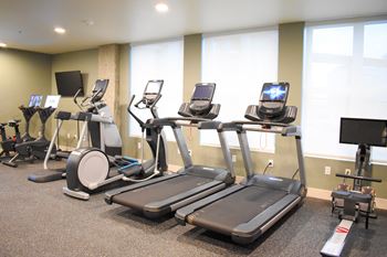 24-Hr fitness center with cardio and free weights