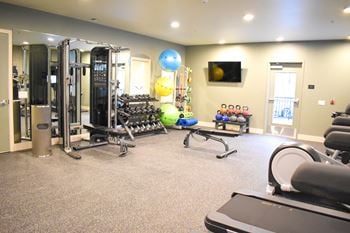 24-Hr fitness center with cardio and free weights