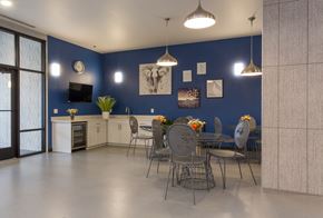 Federal Way apartment for rent - a dining room with a table and chairs in front of a blue wall