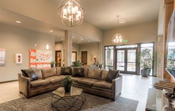 Auburn apartment for rent - a large living room with couches and a coffee table