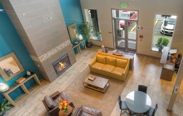 Auburn apartment for rent - an overhead view of a living room with a fireplace and a table