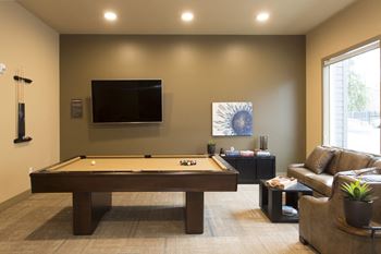 Game room and lounge with billiards table