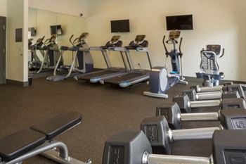 24-Hour fitness studio with cardio & free weights