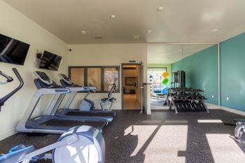 24-Hour fitness studio with cardio & free weights
