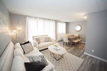 Cornwall apartment for rent - A living room with a white couch and a coffee table.