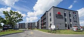 Cornwall apartment for rent - A large building with a red sign on it that says "Bayshore".