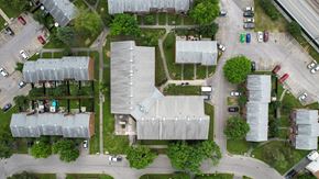 Gatineau townhouse for rent - A bird's eye view of a residential area with houses and cars.