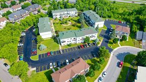 Gatineau apartment for rent - A bird's eye view of a residential area with houses and cars.