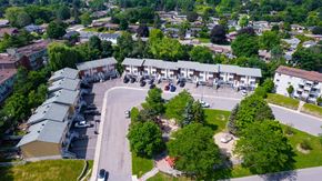 Gatineau townhouse for rent - A bird's eye view of a residential area with houses and a park.
