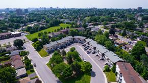 Gatineau townhouse for rent - A bird's eye view of a residential area with houses and roads.