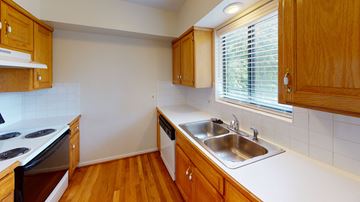 Kansas City apartment for rent - an empty kitchen with a sink and a window