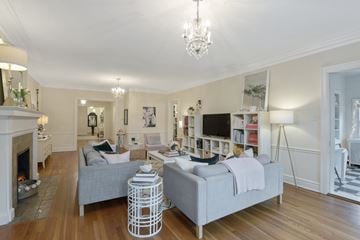 Kansas City apartment for rent - A living room with a grey couch and a white coffee table.