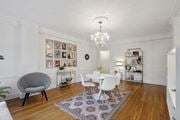 Kansas City apartment for rent - A white dining room with a round table and chairs.
