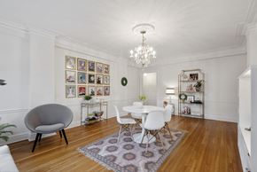 Kansas City apartment for rent - A white dining room with a round table and chairs.