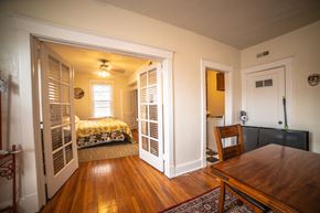 Kansas City apartment for rent - a bedroom with a bed and a dining room table