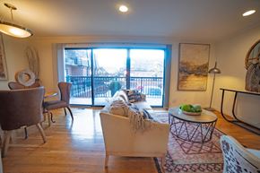 Kansas City apartment for rent - a living room with a sliding glass door to a balcony